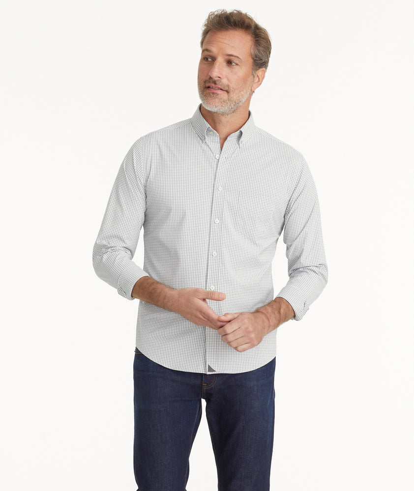 Model is wearing UNTUCKit Wrinkle-Free Performance Maury Shirt in White & Gray Gingham.