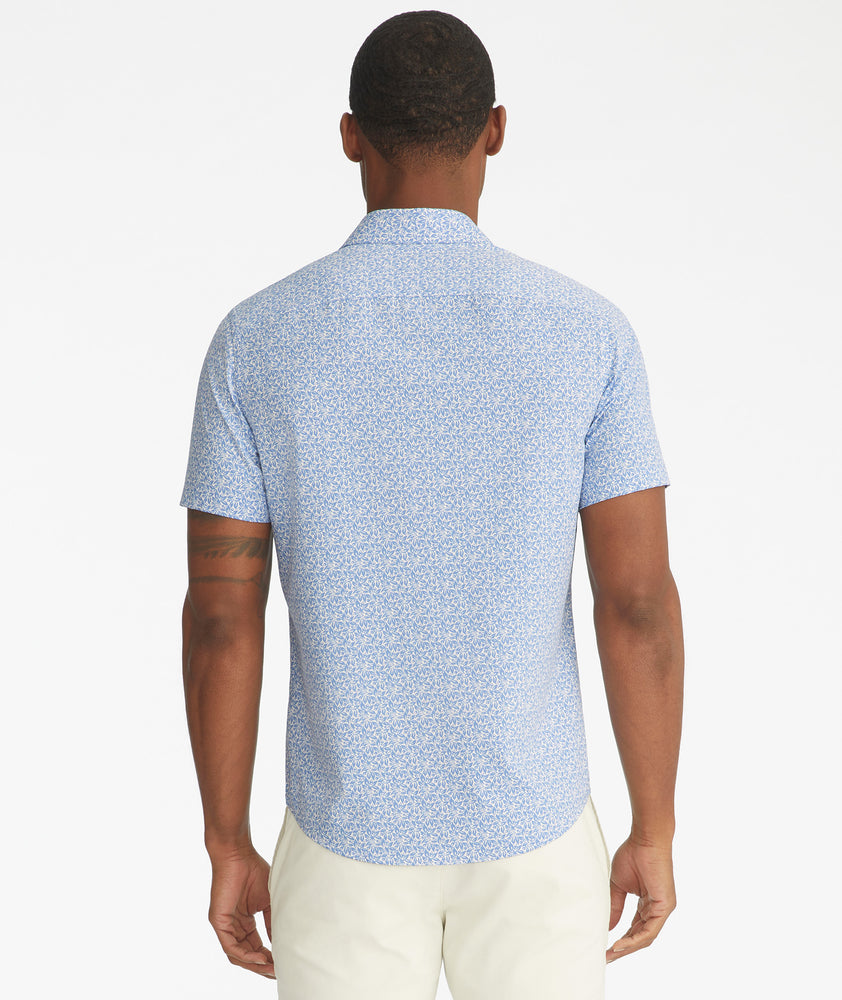 Model is wearing UNTUCKit Mavrud pink short sleeve button down.