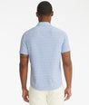 Model is wearing UNTUCKit Mavrud pink short sleeve button down.