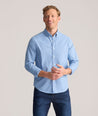 Model is wearing UNTUCKit Performance Mayberry Shirt in Blue Check. 