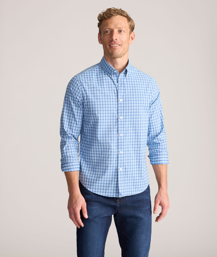 Model is wearing UNTUCKit Performance Mayberry Shirt in Blue Check. 