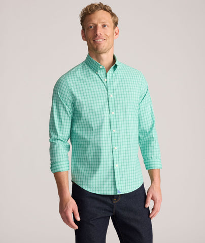 Model is wearing UNTUCKit Performance Mayberry Shirt in green Check. 