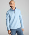Model is wearing UNTUCKit Performance Quarter-Zip in Light Blue. 