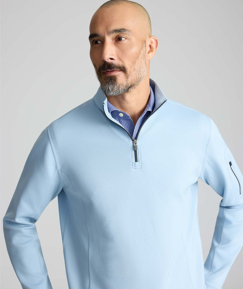 Model is wearing UNTUCKit Performance Quarter-Zip in Light Blue. 