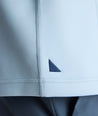 Model is wearing UNTUCKit Performance Quarter-Zip in Light Blue. 