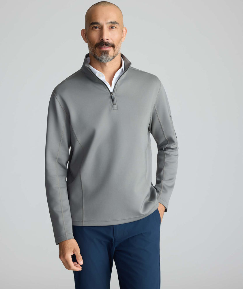 Model is wearing UNTUCKit Performance Quarter-Zip in Slate Gray. 