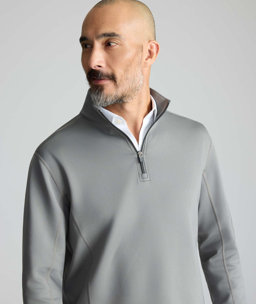 Model is wearing UNTUCKit Performance Quarter-Zip in Slate Gray. 