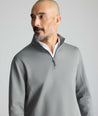 Model is wearing UNTUCKit Performance Quarter-Zip in Slate Gray. 