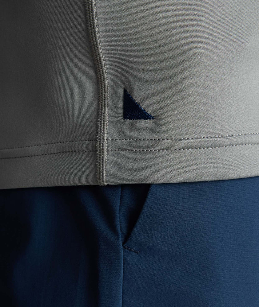 Model is wearing UNTUCKit Performance Quarter-Zip in Slate Gray. 