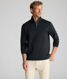Model wearing a  Performance Quarter-Zip in black.