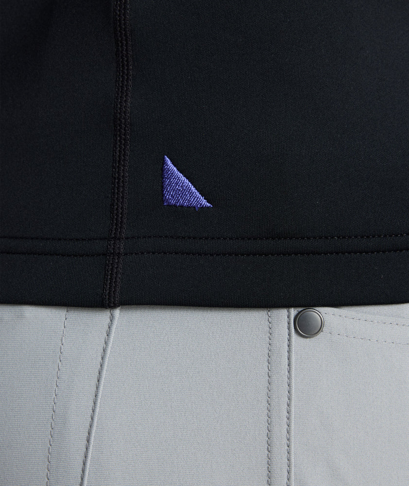 Model wearing a  Performance Quarter-Zip in black.