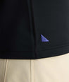 Model wearing a  Performance Quarter-Zip in black.