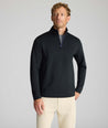 Model wearing a  Performance Quarter-Zip in black.
