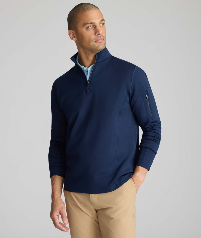 Model is wearing UNTUCKit performance sweatshirt in navy.