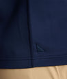 Model is wearing UNTUCKit performance sweatshirt in navy.