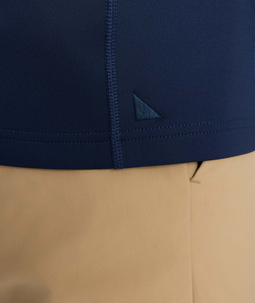Model is wearing UNTUCKit performance sweatshirt in navy.