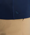 Model is wearing UNTUCKit performance sweatshirt in navy.