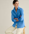 Model is wearing UNTUCKit Melanie shirt in blue. 