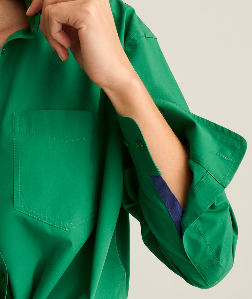 Model is wearing UNTUCKit Melanie shirt in green. 