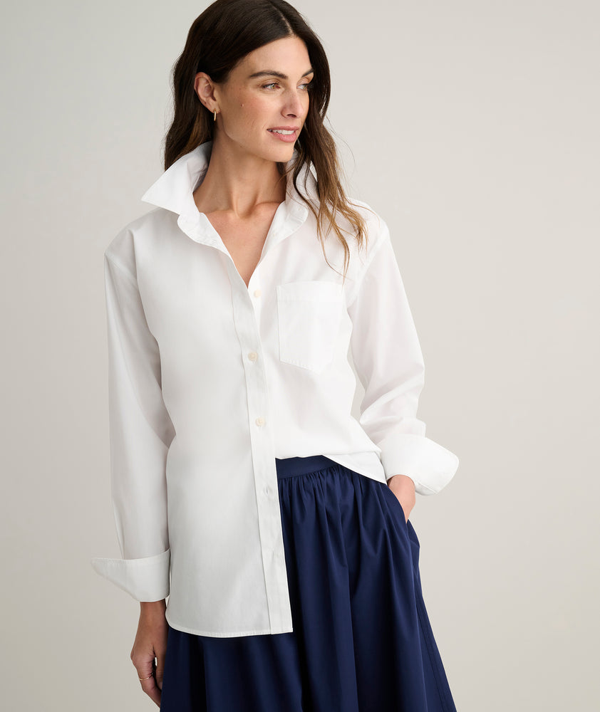Model is wearing UNTUCKit Melanie shirt in White.