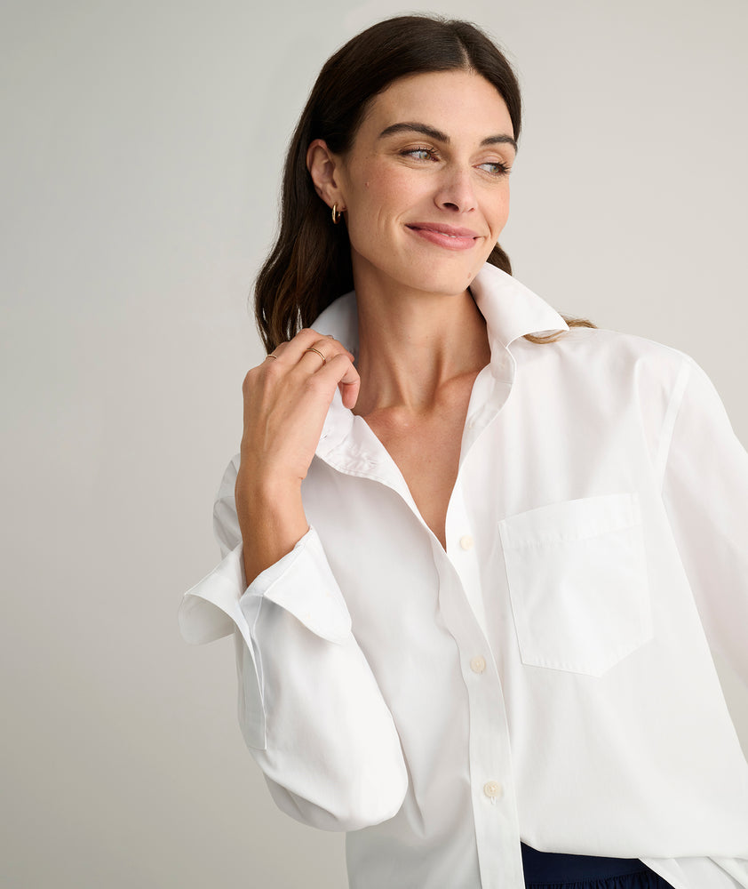 Model is wearing UNTUCKit Melanie shirt in White.