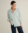 Model is wearing UNTUCKit Melanie in green striped. 