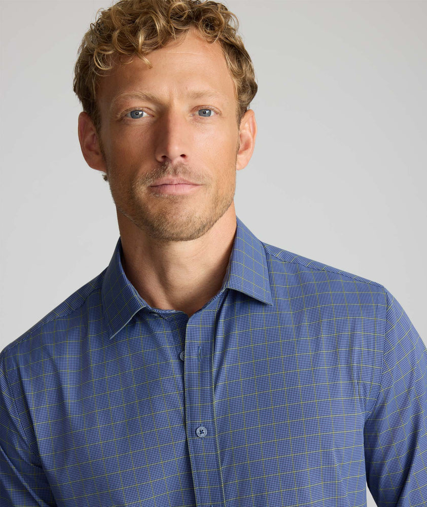 Model wearing a blue check UNTUCKit Performance Shirt.