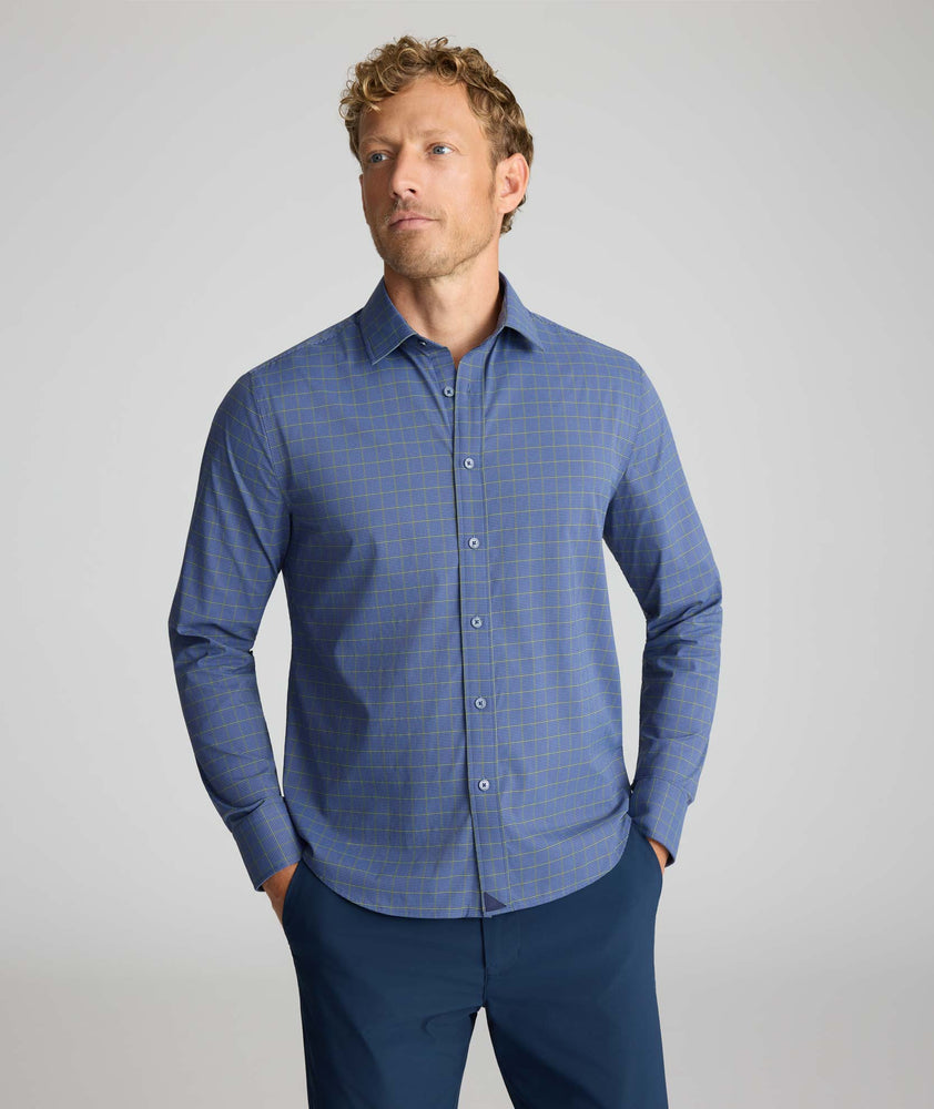 Model wearing a blue check UNTUCKit Performance Shirt.