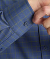 Model wearing a blue check UNTUCKit Performance Shirt.