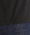 Model is wearing UNTUCKIt Merille long sleeve Tencel Tee in black.
