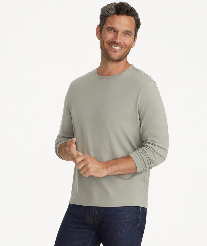 Model is wearing UNTUCKIt Merille long sleeve Tencel Tee in Military Green.
