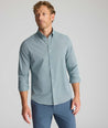 Model is wearing UNTUCKit Performance Milford Shirt in green print.