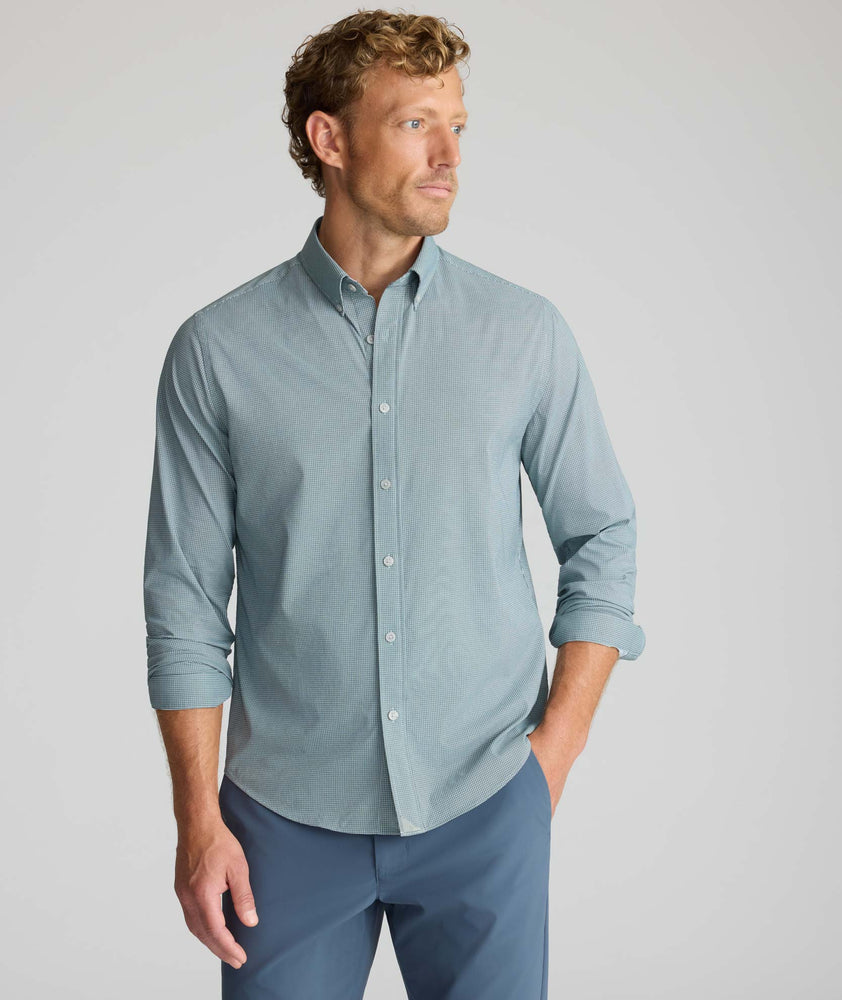 Model is wearing UNTUCKit Performance Milford Shirt in green print.