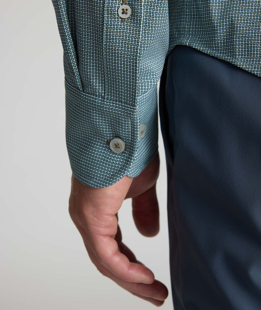 Model is wearing UNTUCKit Performance Milford Shirt in green print.