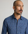 Model is wearing UNTUCKit Millerford performance print shirt. 
