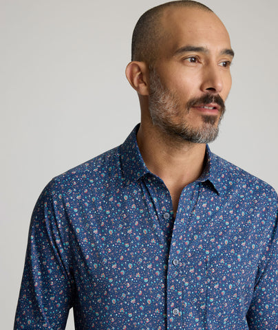 Model is wearing UNTUCKit Millerford performance print shirt. 