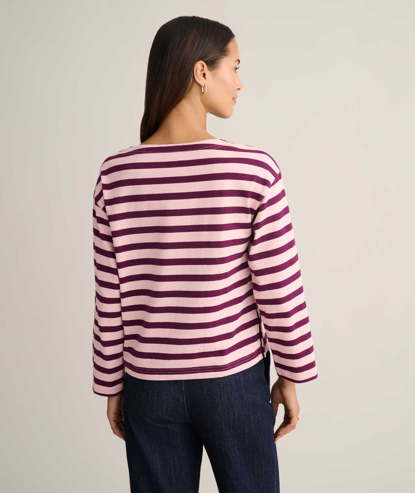 Model is wearing UNTUCKit Cotton Jersey Mille Stripe Tee in pink. 