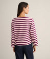 Model is wearing UNTUCKit Cotton Jersey Mille Stripe Tee in pink. 