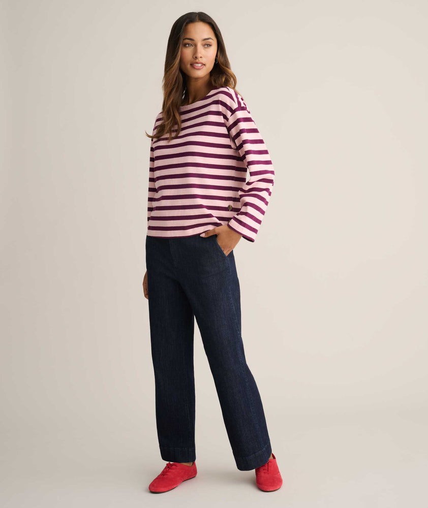 Model is wearing UNTUCKit Cotton Jersey Mille Stripe Tee in pink. 