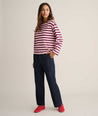 Model is wearing UNTUCKit Cotton Jersey Mille Stripe Tee in pink. 