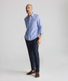 Model is wearing UNTUCKit Stretch Cotton Hybrid Pants in Navy.