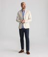 Model is wearing UNTUCKit Stretch Cotton Hybrid Pants in Navy.