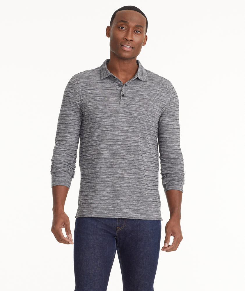 Model is wearing UNTUCKit Marled Long-Sleeve Polo in light black.