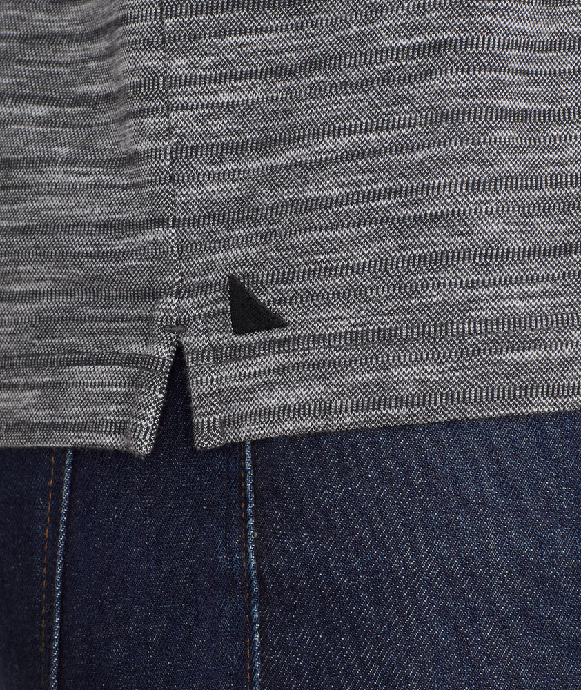 Model is wearing UNTUCKit Marled Long-Sleeve Polo in light black.