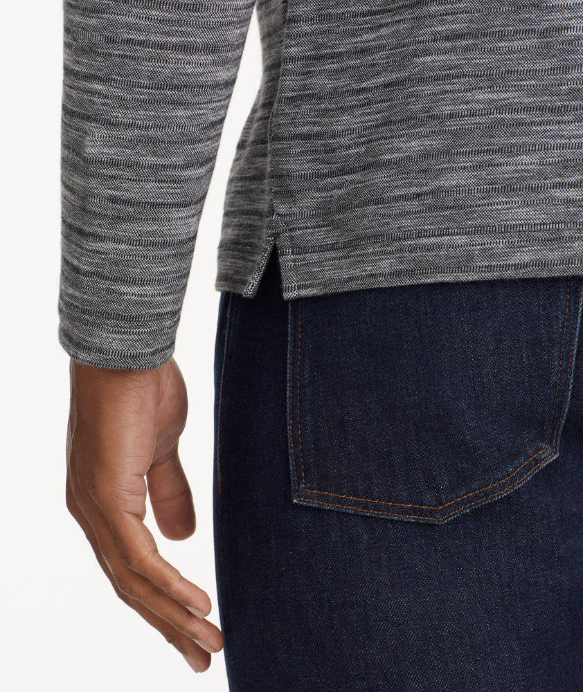 Model is wearing UNTUCKit Marled Long-Sleeve Polo in light black.