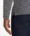 Model is wearing UNTUCKit Marled Long-Sleeve Polo in light black.