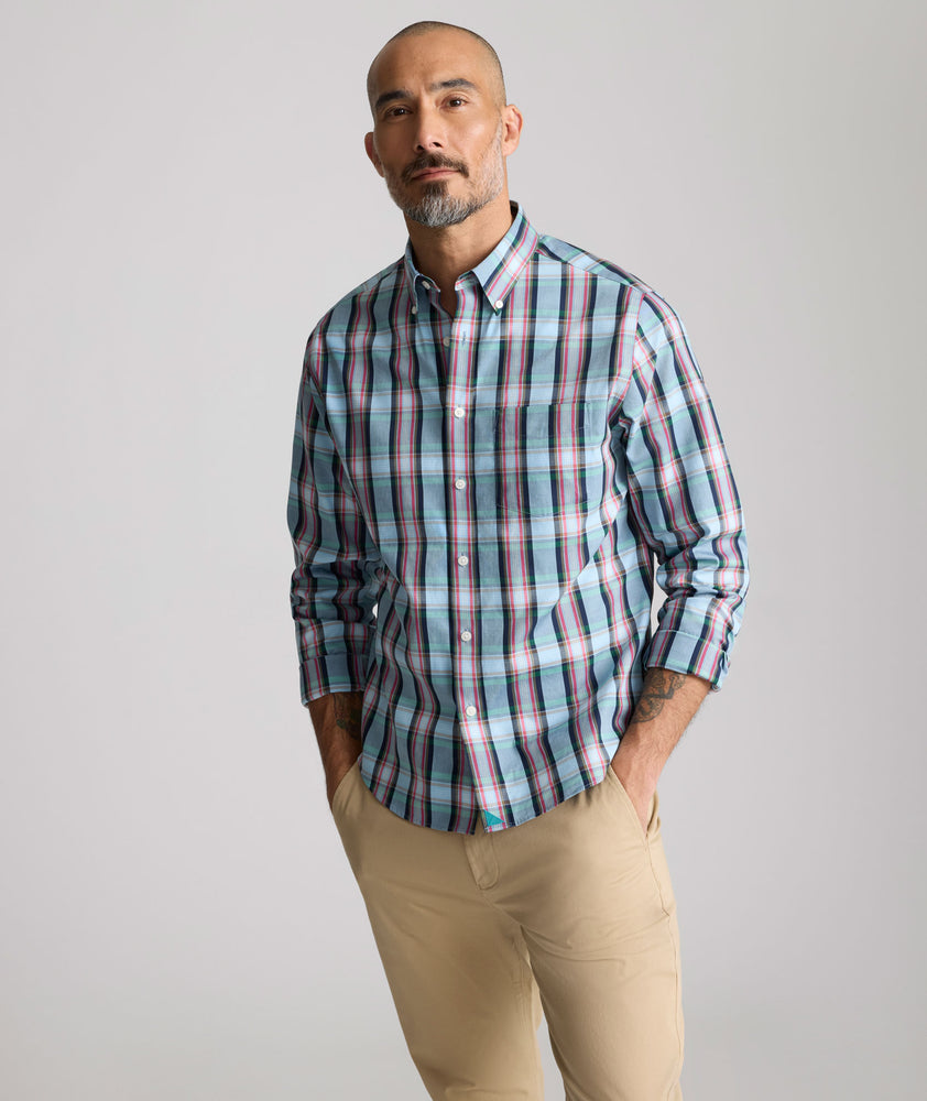 Model is wearing UNTUCKit Wrinkle-Free Morales Shirt in blue. 