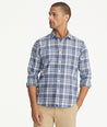 Model is wearing UNTUCKit Flannel Morenillo Shirt in Heathered Blue Plaid