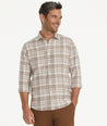 Model is wearing UNTUCKit Flannel Morisco Shirt in Tan Heathered Plaid.