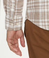 Model is wearing UNTUCKit Flannel Morisco Shirt in Tan Heathered Plaid.